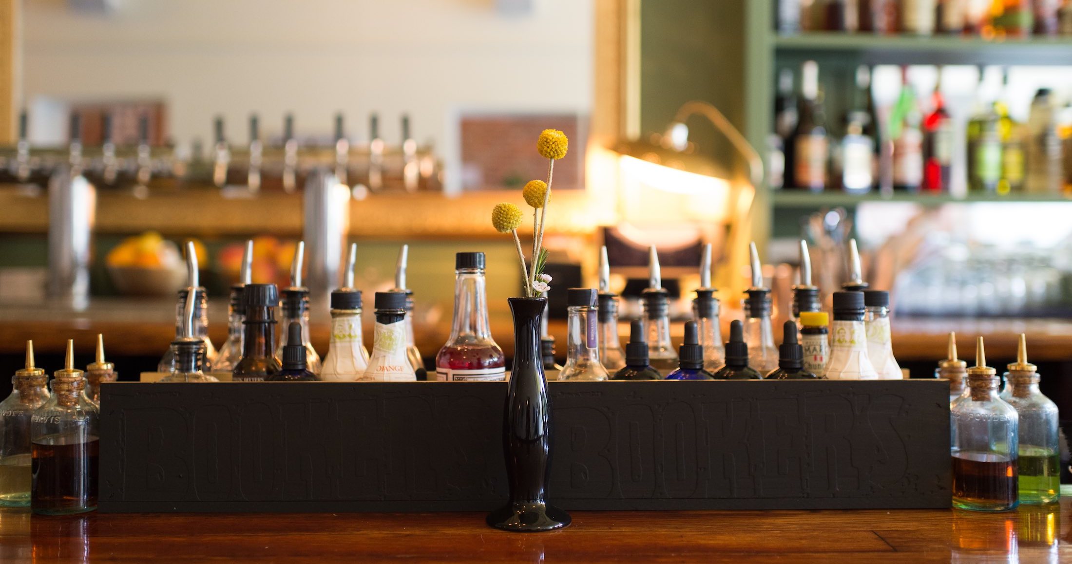 bar with flowers and bottles
